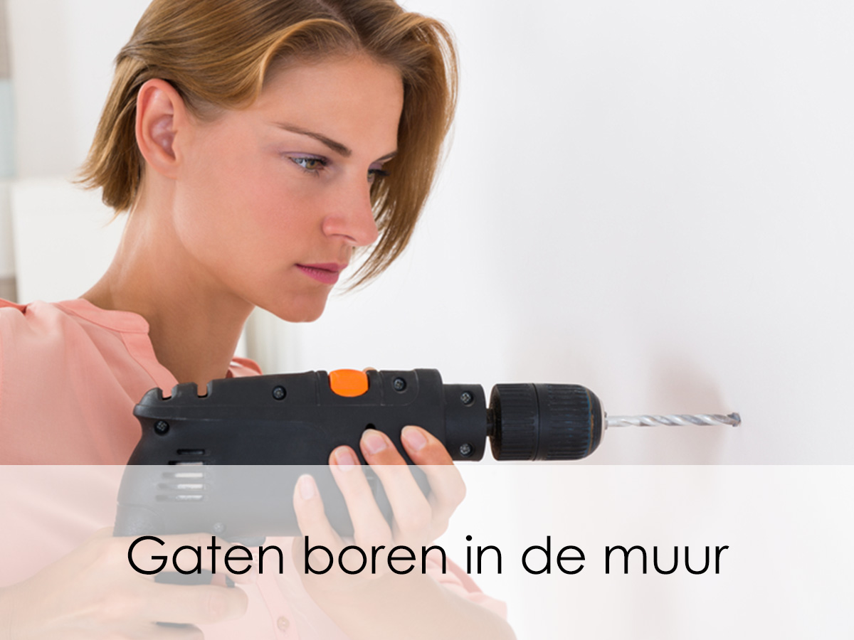 Gaten boren in de muur